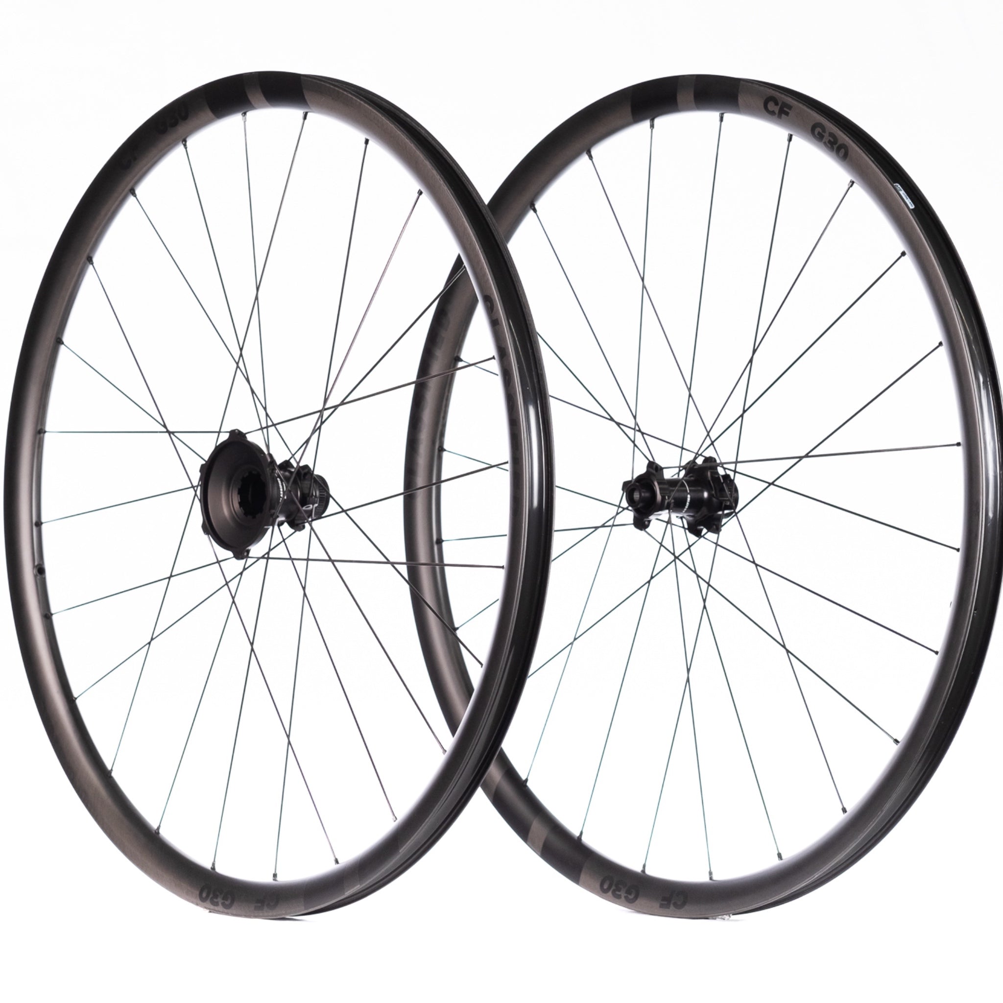 Two bicycle wheels with black rims and hubs on a white background