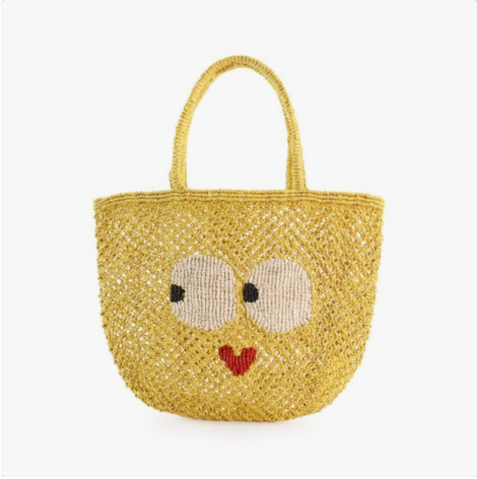The Jacksons Mabel Sweetheart handmade jute tote bag in yellow featuring oversized eyes and a heart-shaped smile, perfect for everyday carry, shopping, and summer outings.